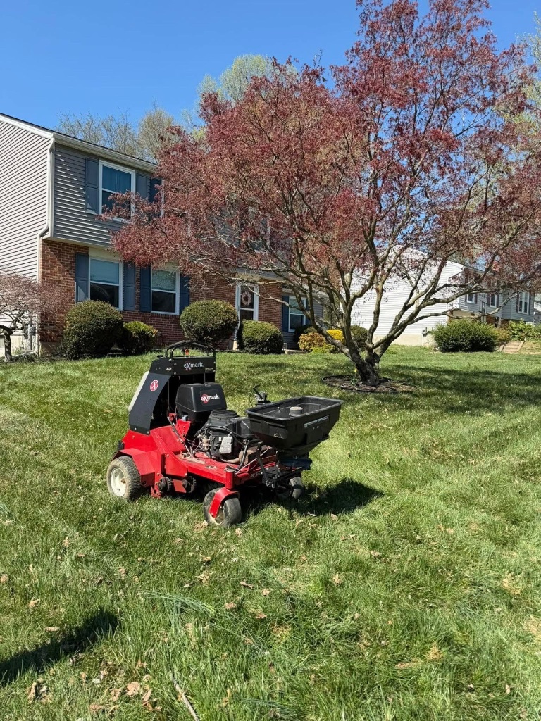 Aeration tractor working on lawn in Harford County
