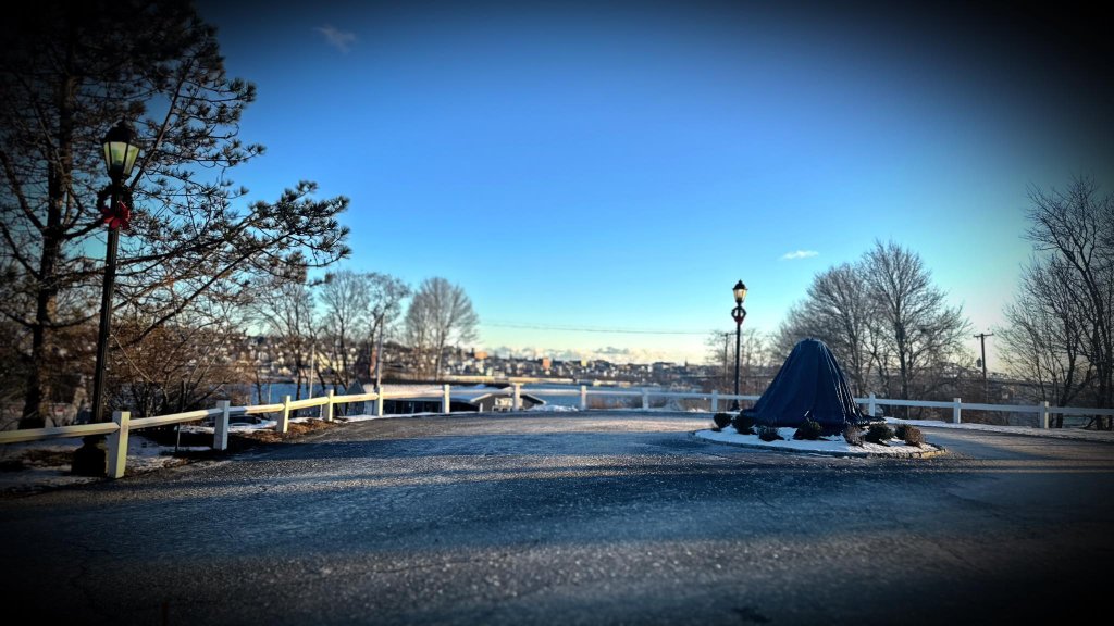 Frosty winter overlook with river and town in background