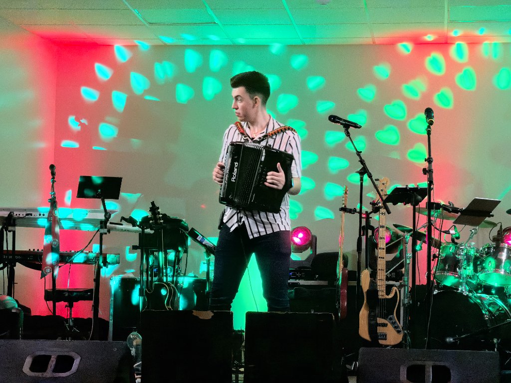 Performer singing with accordion at Taste of Portugal 2026
