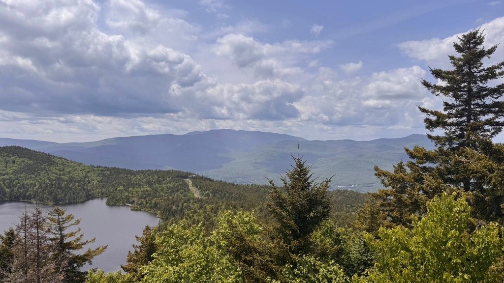 Mountain range vista with lake below