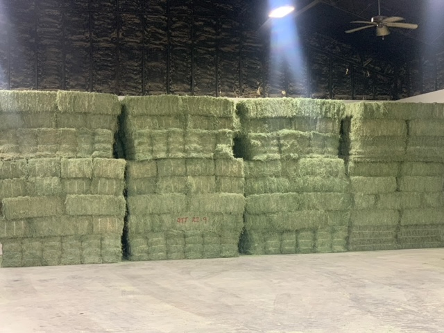 Hay stacked in warehouse at Long Farm & Ranch Supply