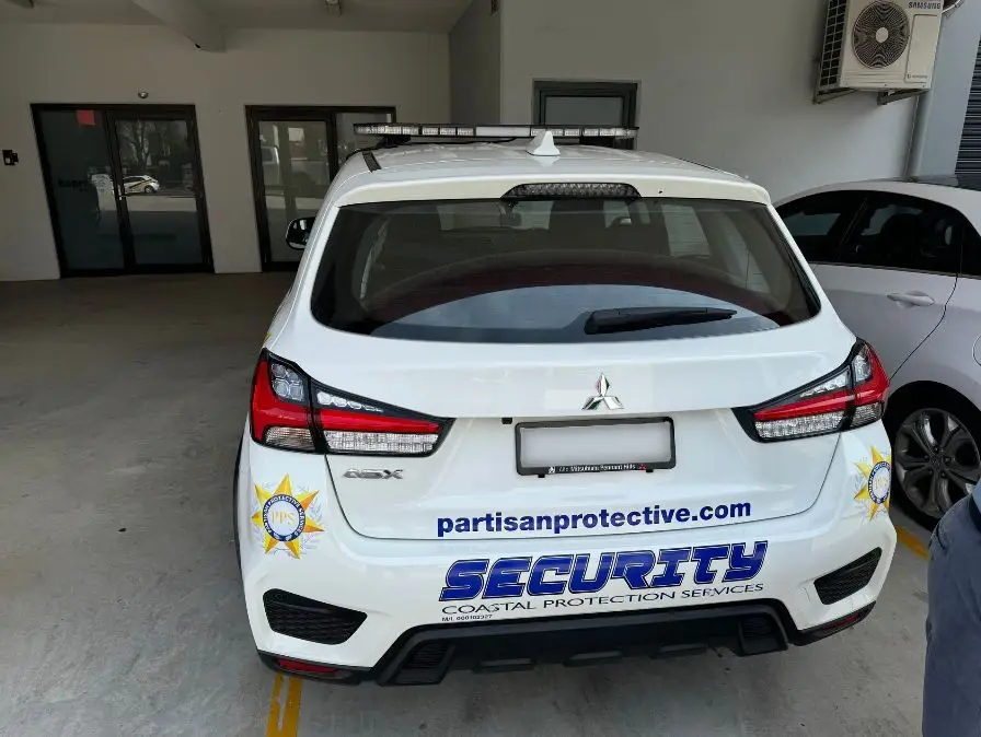 Coastal Protection Services patrol vehicle rear view with light bar
