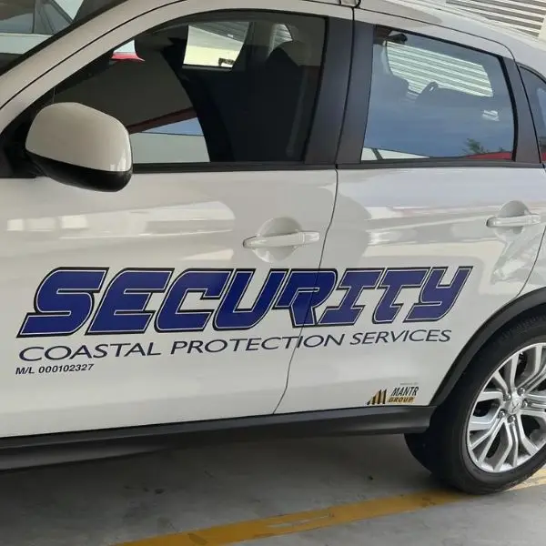 Coastal Protection Services security vehicle door branding — licensed M/L 000102327