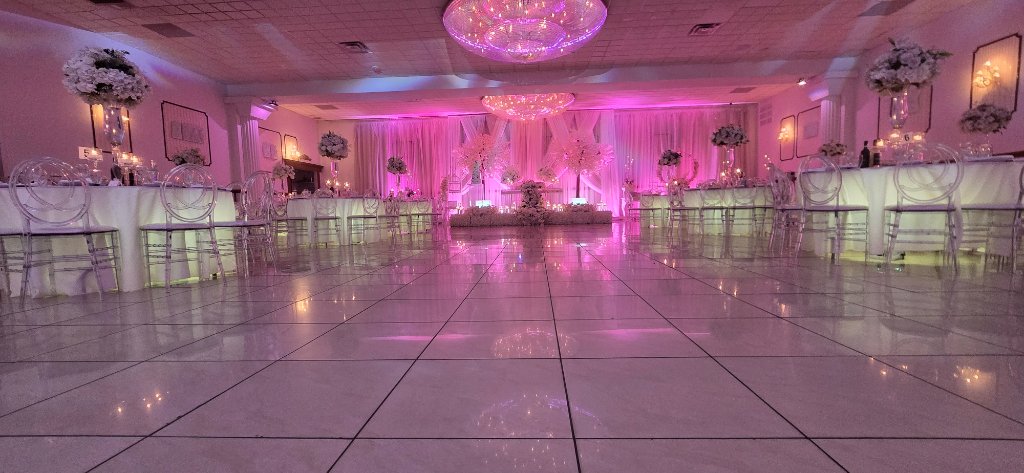 Wedding ballroom floor level view with pink lighting