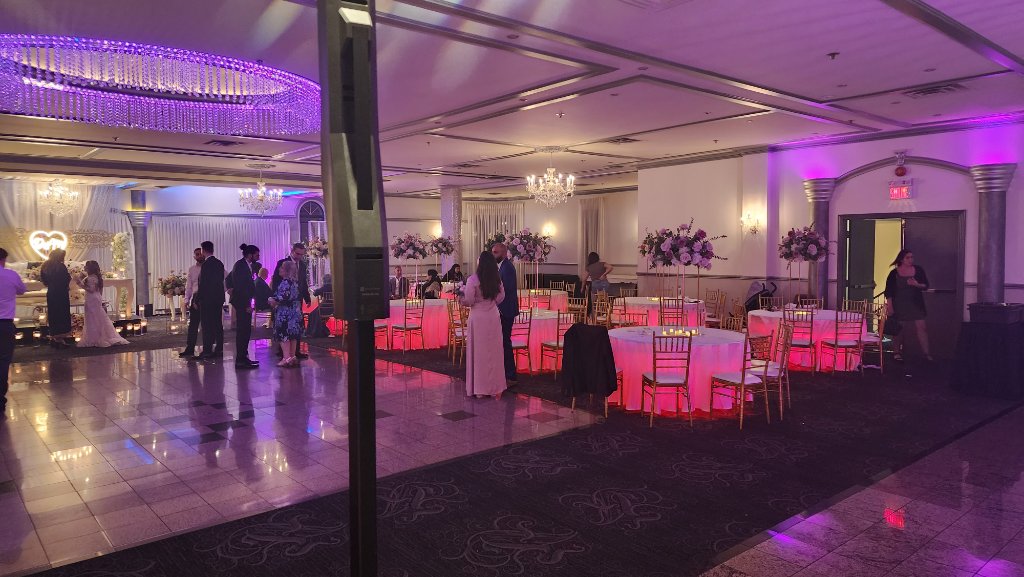 Wedding reception with pink and purple lighting