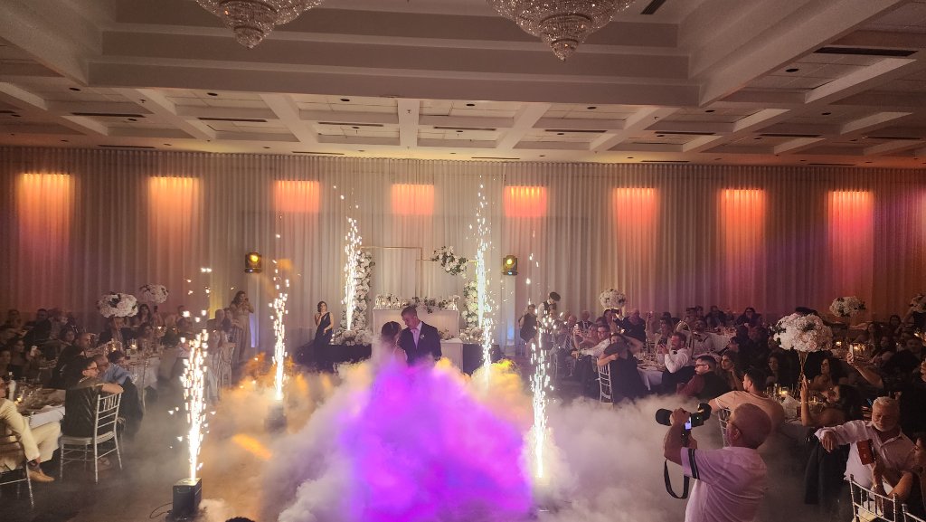 Large wedding reception with crystal chandeliers