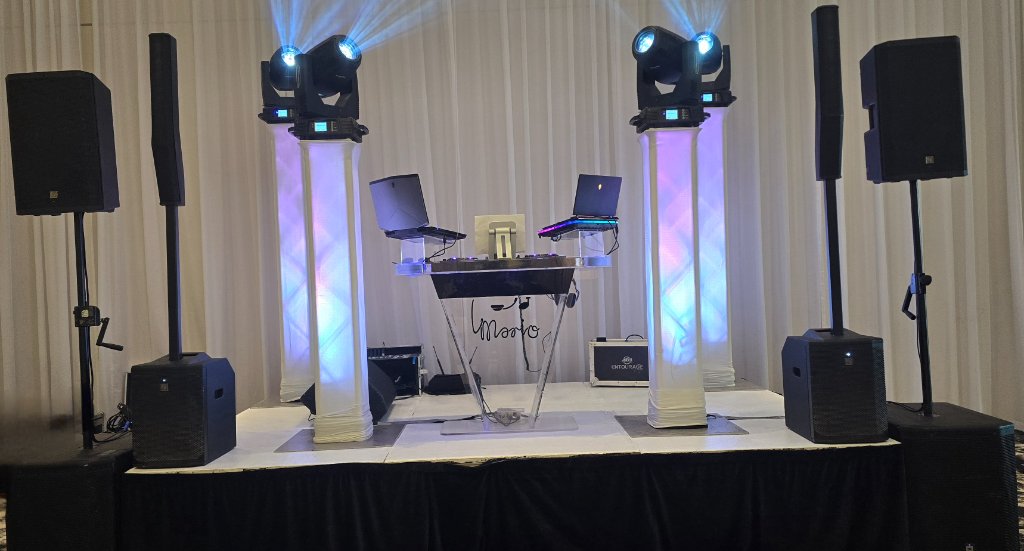 DJ Mario professional booth setup with moving heads