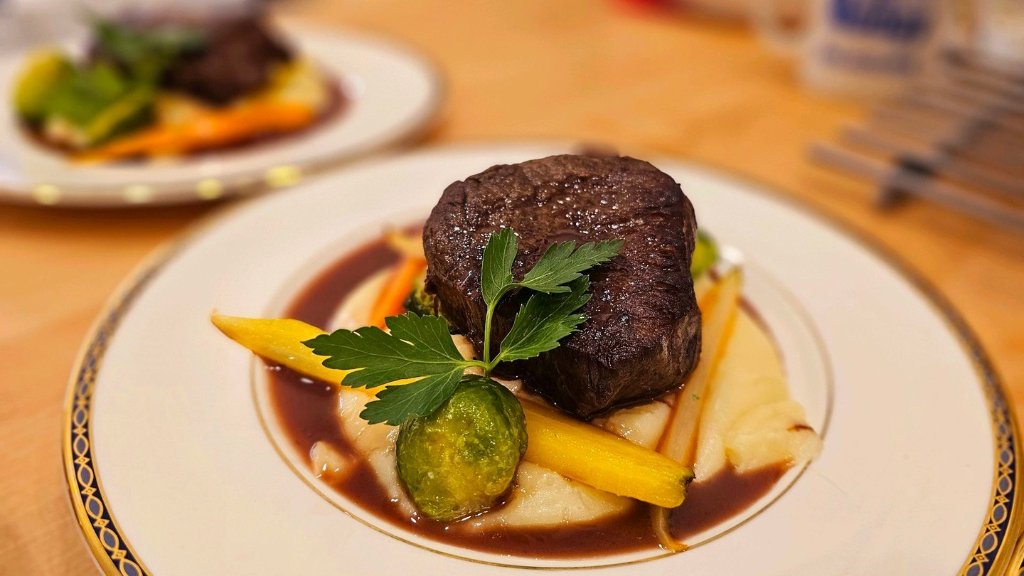 Plated beef filet with seasonal garnish, formal plated service by Chez Mylo event caterers