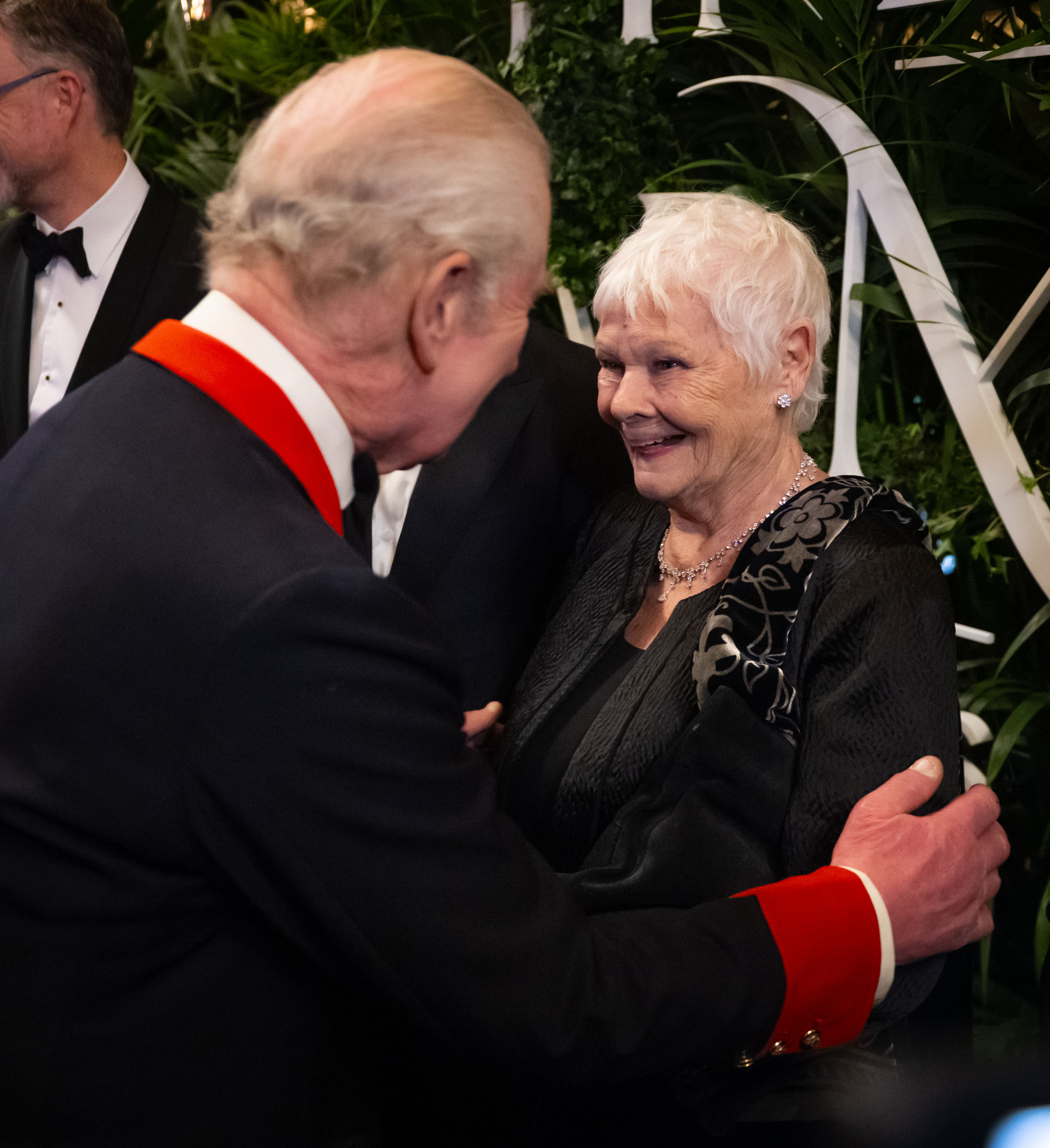 King Charles III greeting Dame Judi Dench at the premiere of Finding Harmony: A King’s Vision.