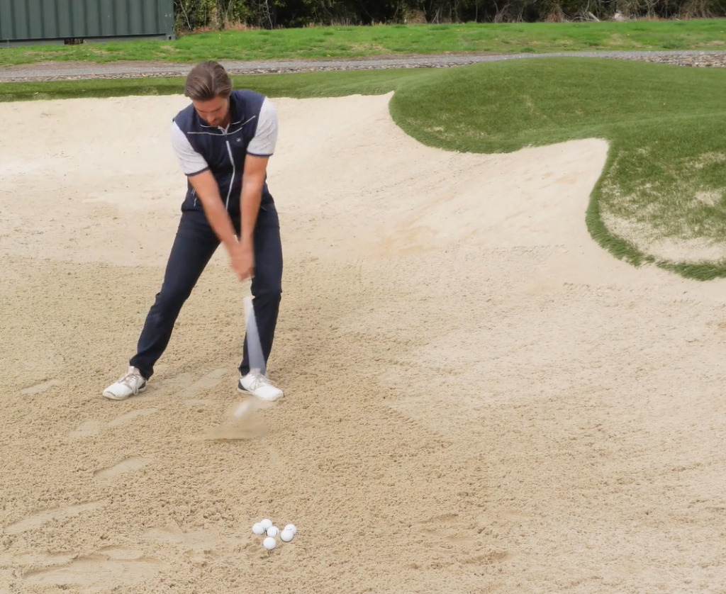 James Willis striking a bunker shot
