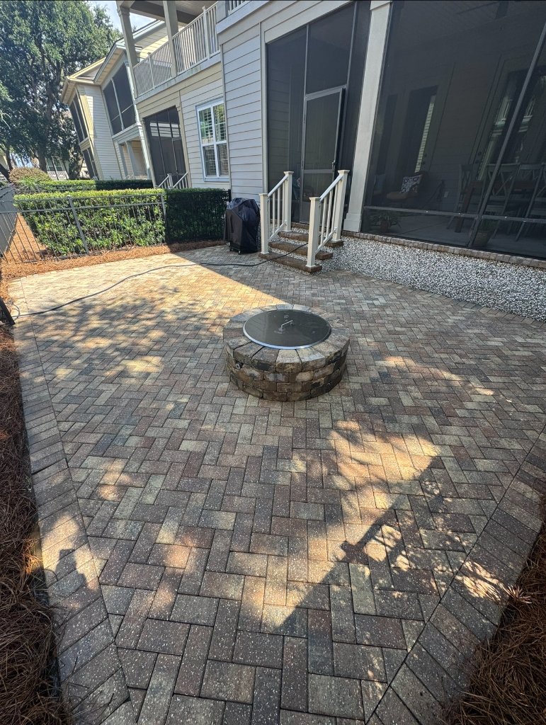 Clean and bright patio with restored pavers after Blueprint Construction professional pressure washing service — Golden Isles, GA