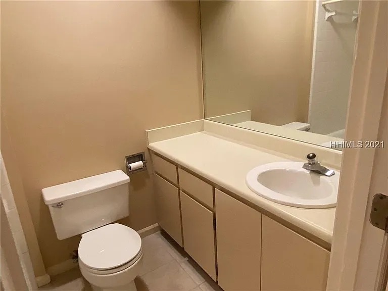 Basic builder-grade bathroom with simple vanity before Blueprint Construction upgrade — Golden Isles, GA
