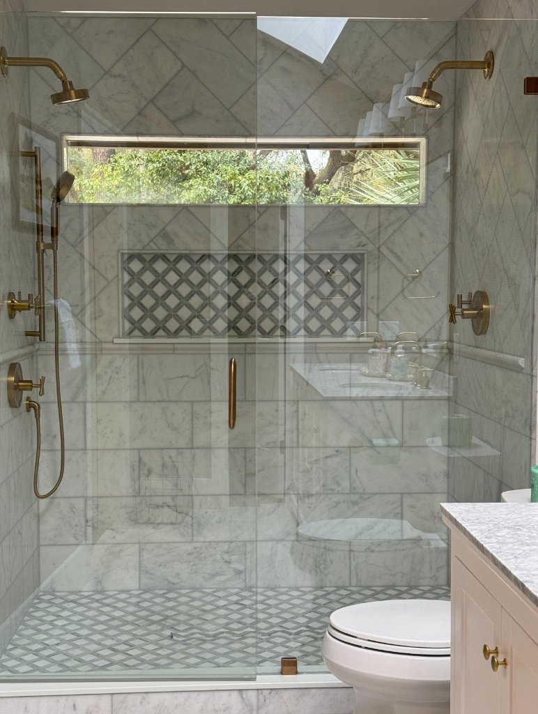 Master bathroom with marble herringbone tile - Blueprint Construction