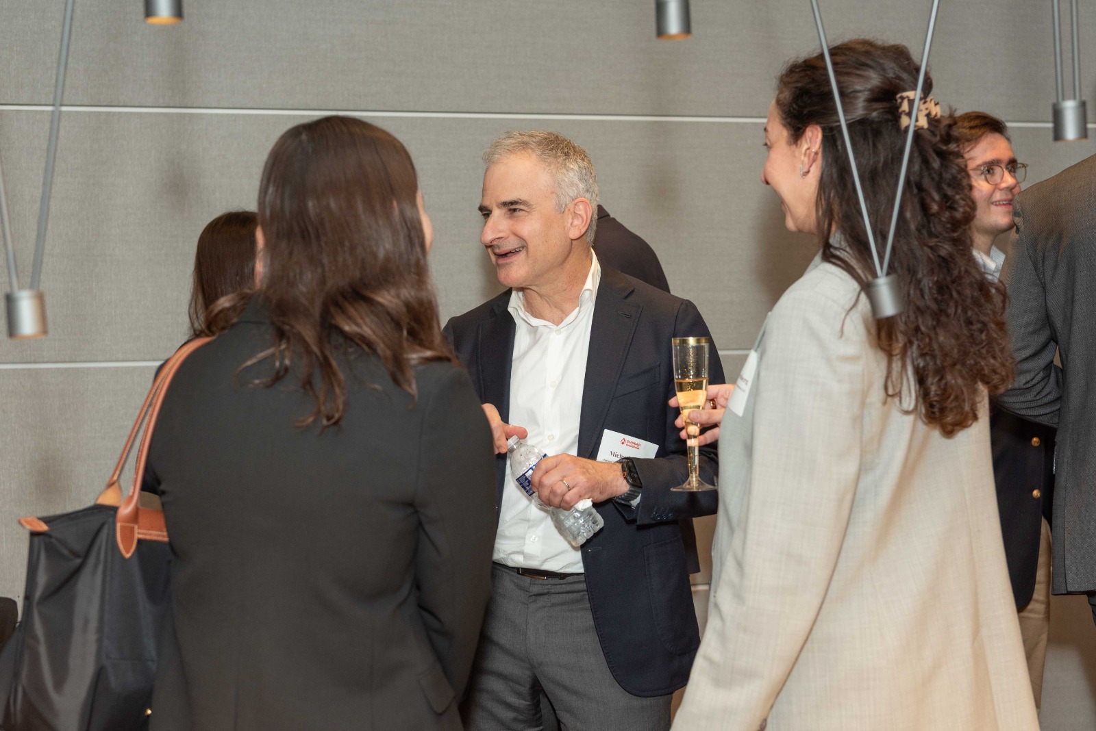 Attorneys and students chatting over drinks