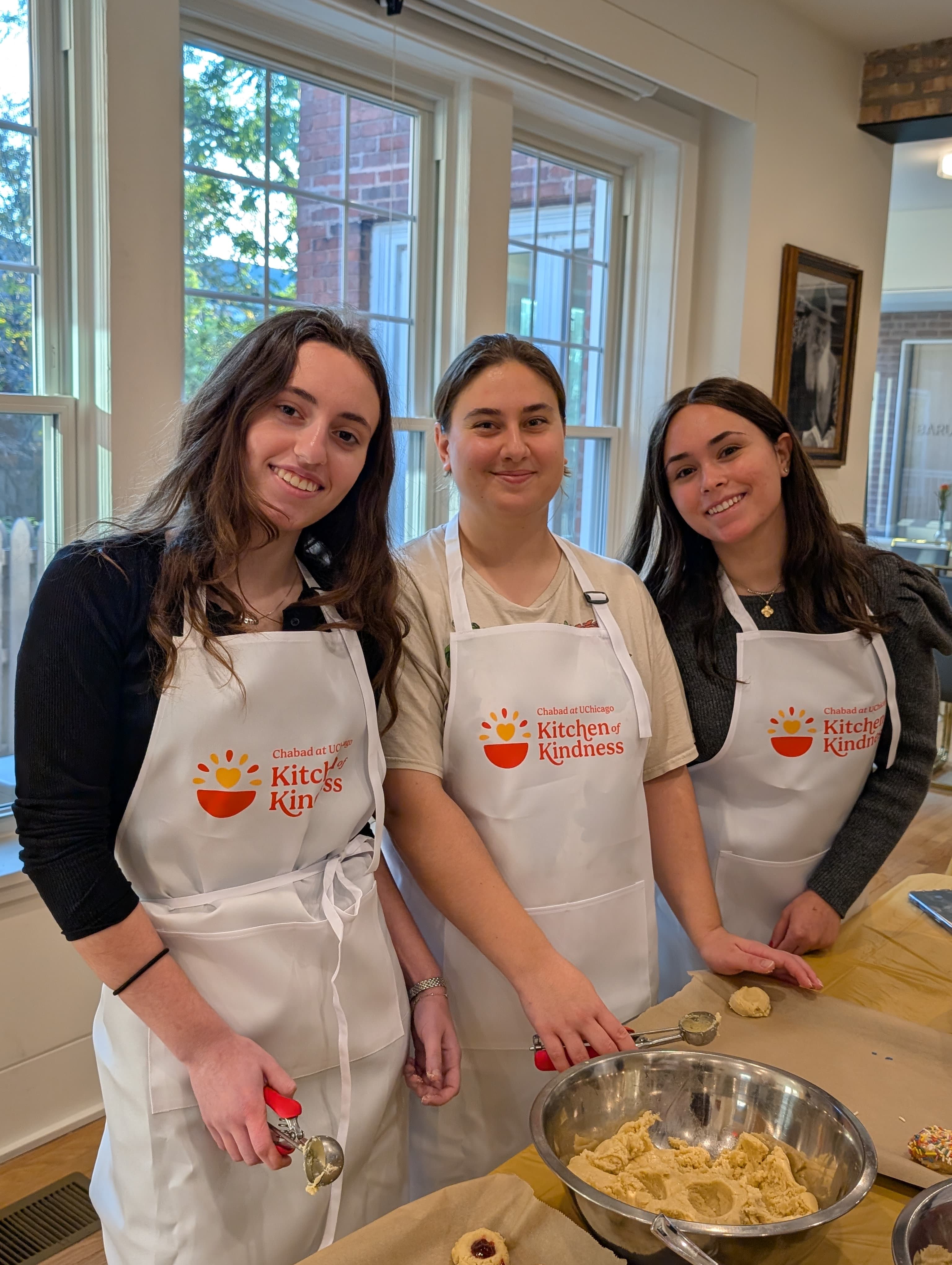 Kitchen of Kindness apron with the Chabad at UChicago logo