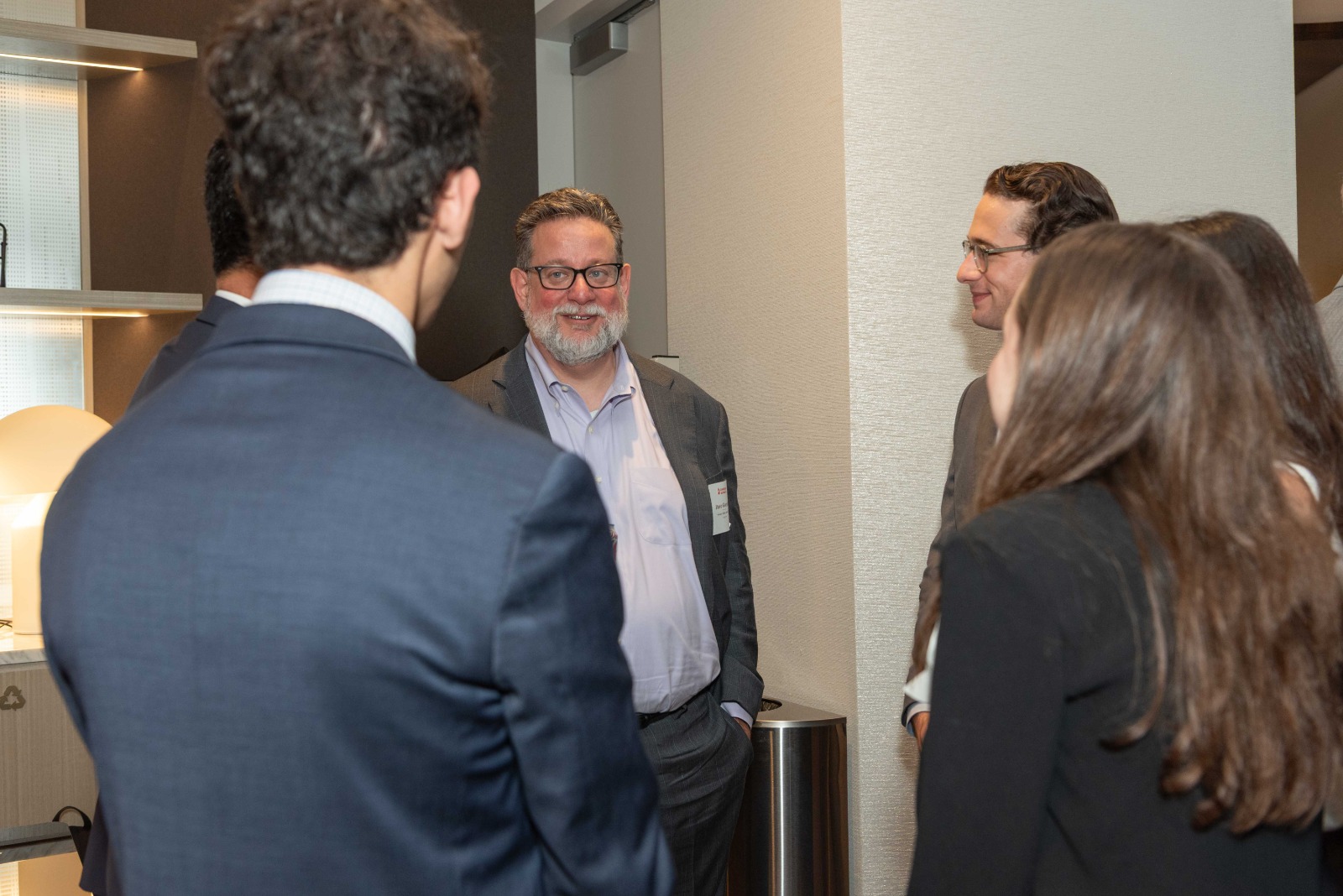 An attorney smiling mid-conversation