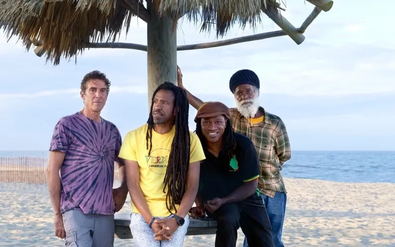 The Verdict band stage setup with Caribbean instruments