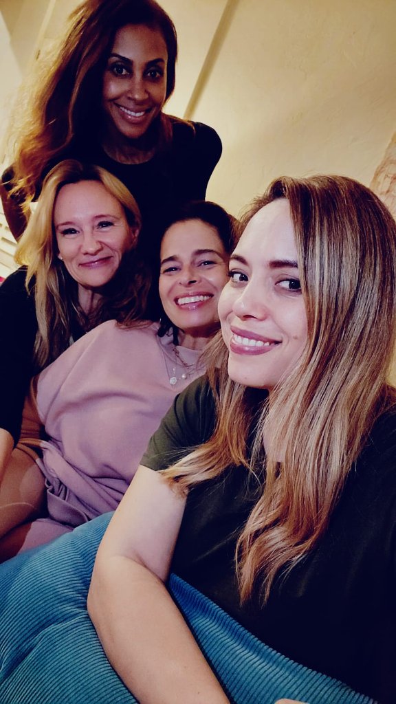 Sisters together, close and smiling