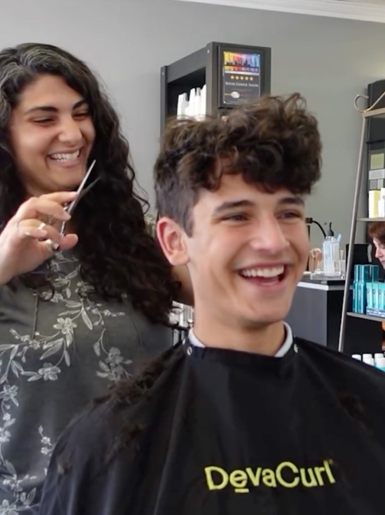 Good vibes only 😄✂️ Curly cut in session — smiles are always part of the service!