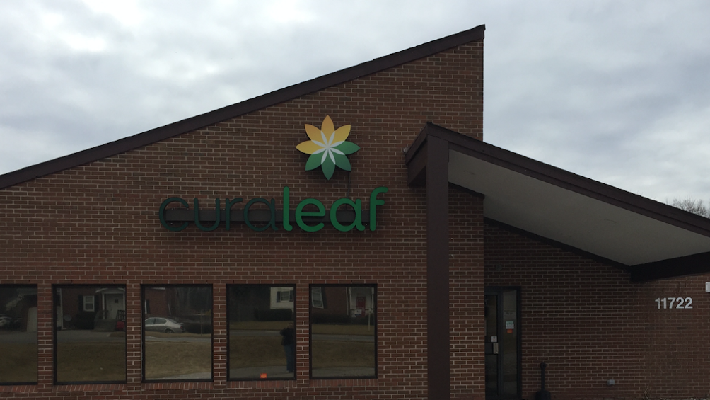 Curaleaf signage on the brick exterior of its Reisterstown dispensary in a 2018 archival photograph