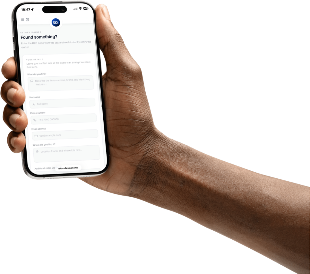 Person holding iPhone showing the Return2Owner Found something? report form