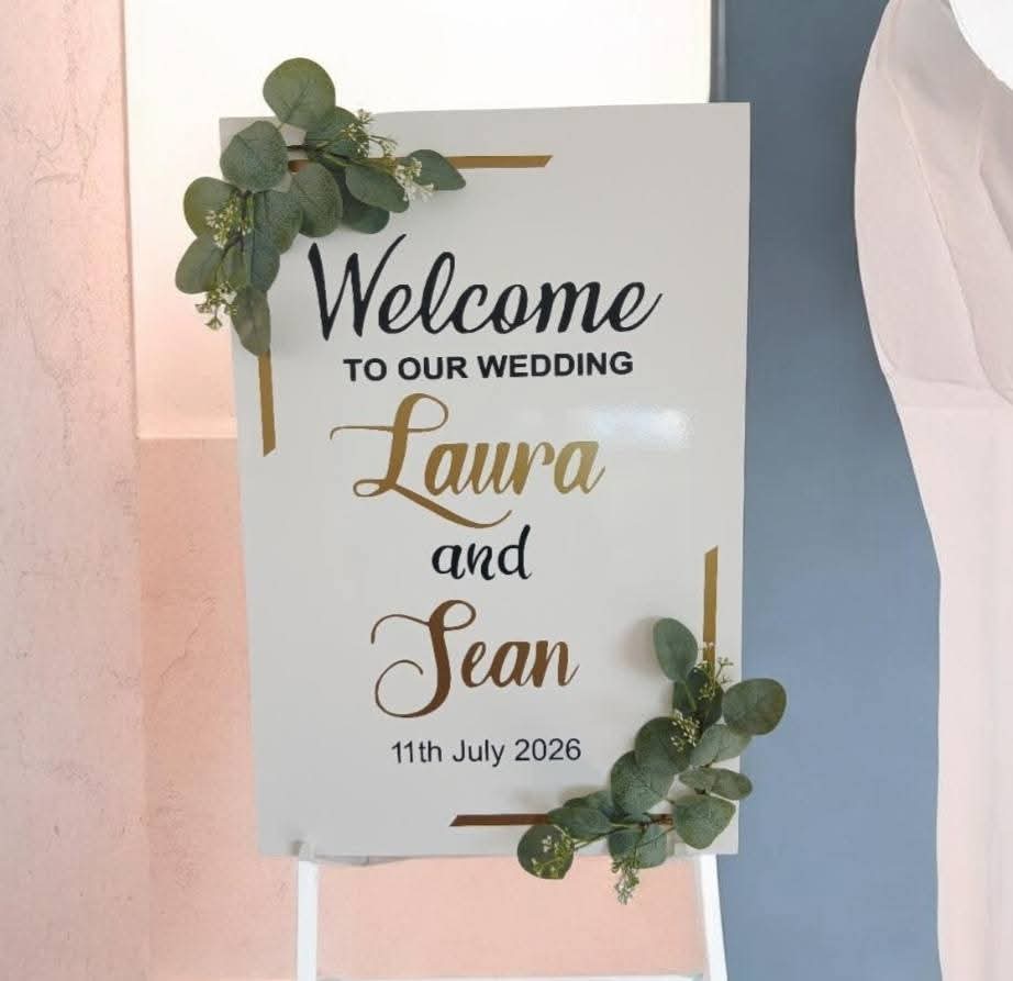 Laura and Sean wedding welcome sign with gold script names
