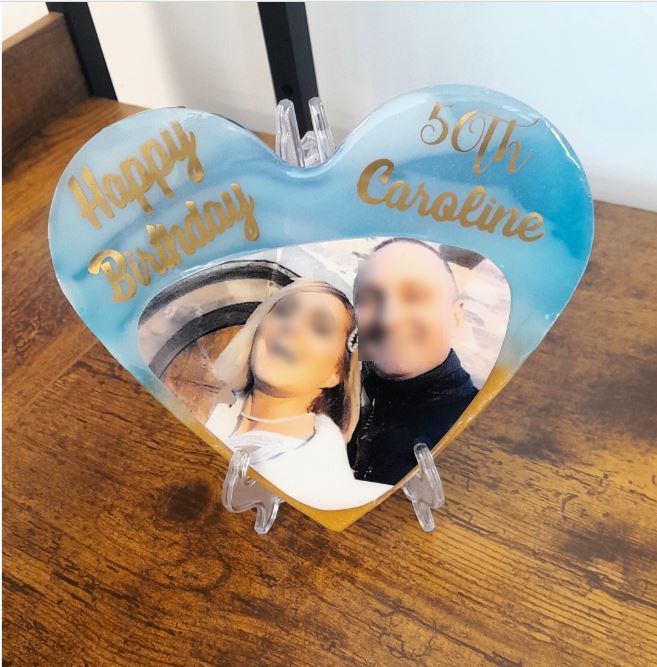 Heart shaped resin plaque for Caroline 50th birthday with blue swirl border and gold text