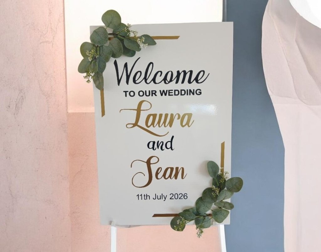 Wedding welcome sign with gold script names Laura and Sean