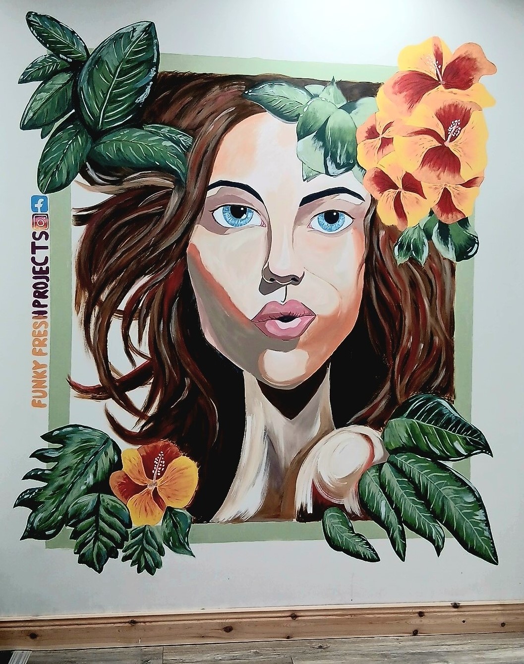 Funky Fresh Projects mural portrait of a woman with vibrant flowers