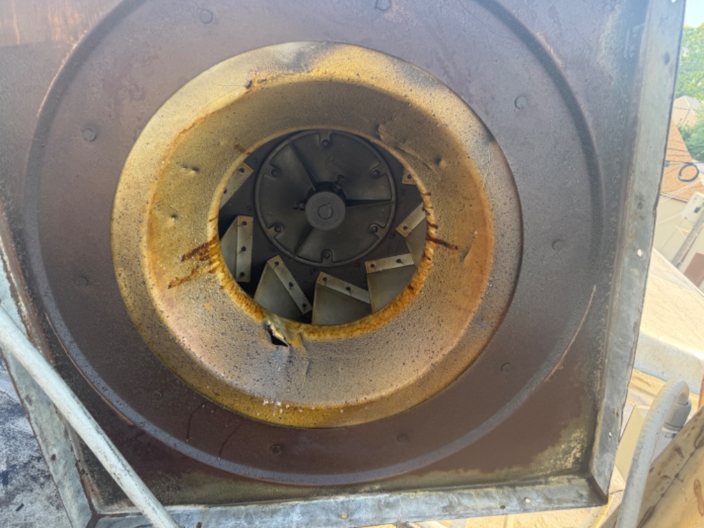 Fan housing grease buildup