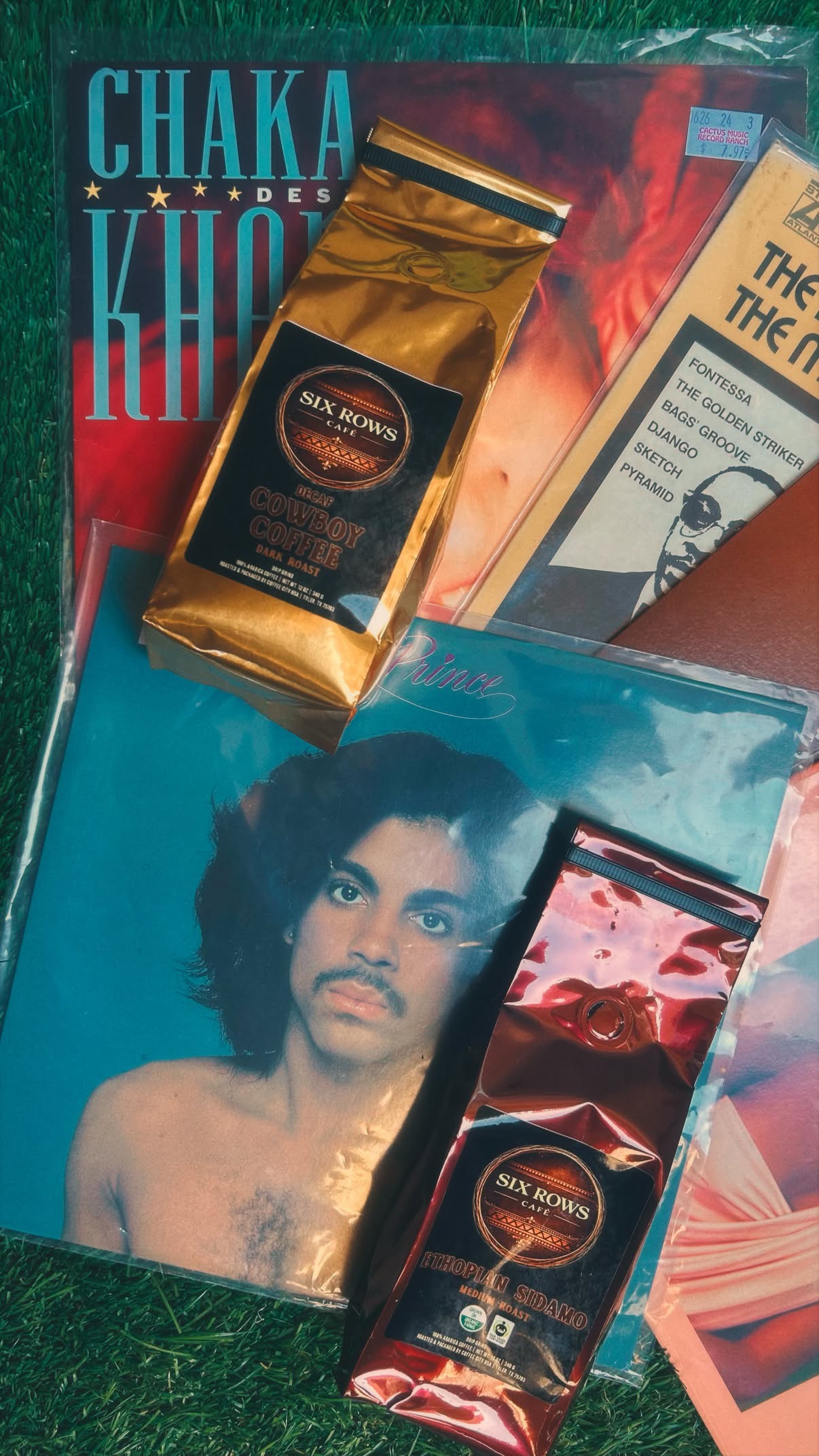 Six Rows Café specialty coffee bags on vinyl records