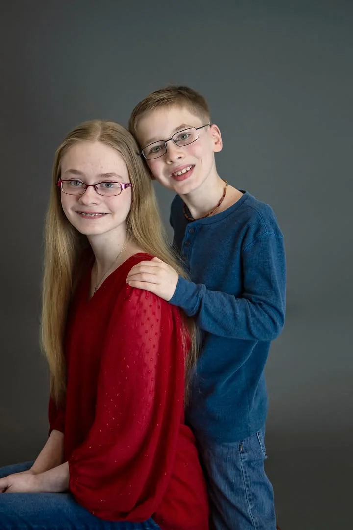 Studio portrait session photographed on a backdrop in Plain Dealing