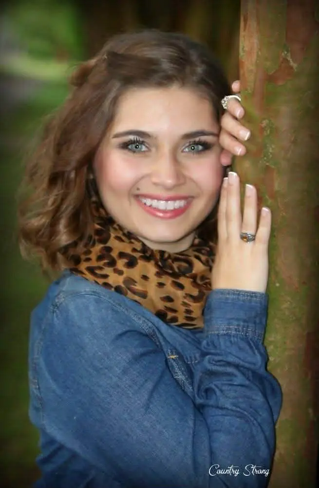High school senior portrait photographed outdoors in natural light