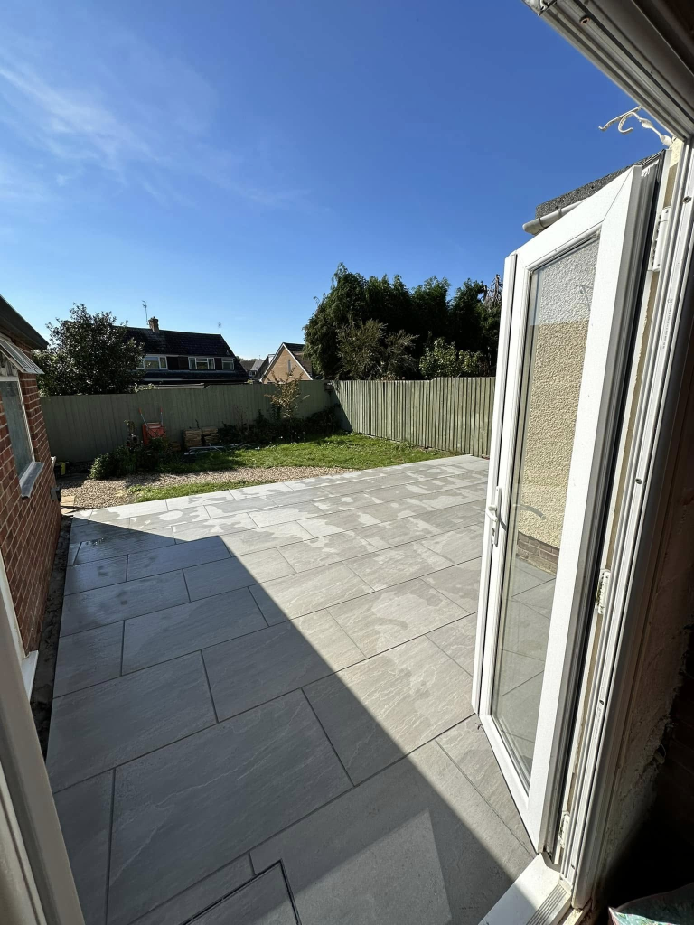 Porcelain Patio with Retaining Wall & Step photo 2