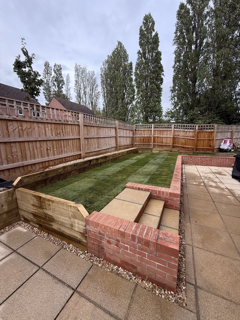 Garden Level Transformation: Sleeper Walls, Extended Patio, Turf & Bin Store photo 3