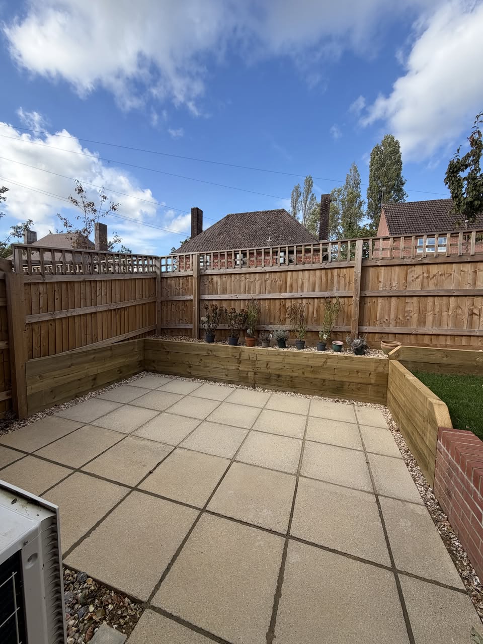 Garden Level Transformation: Sleeper Walls, Extended Patio, Turf & Bin Store photo 2