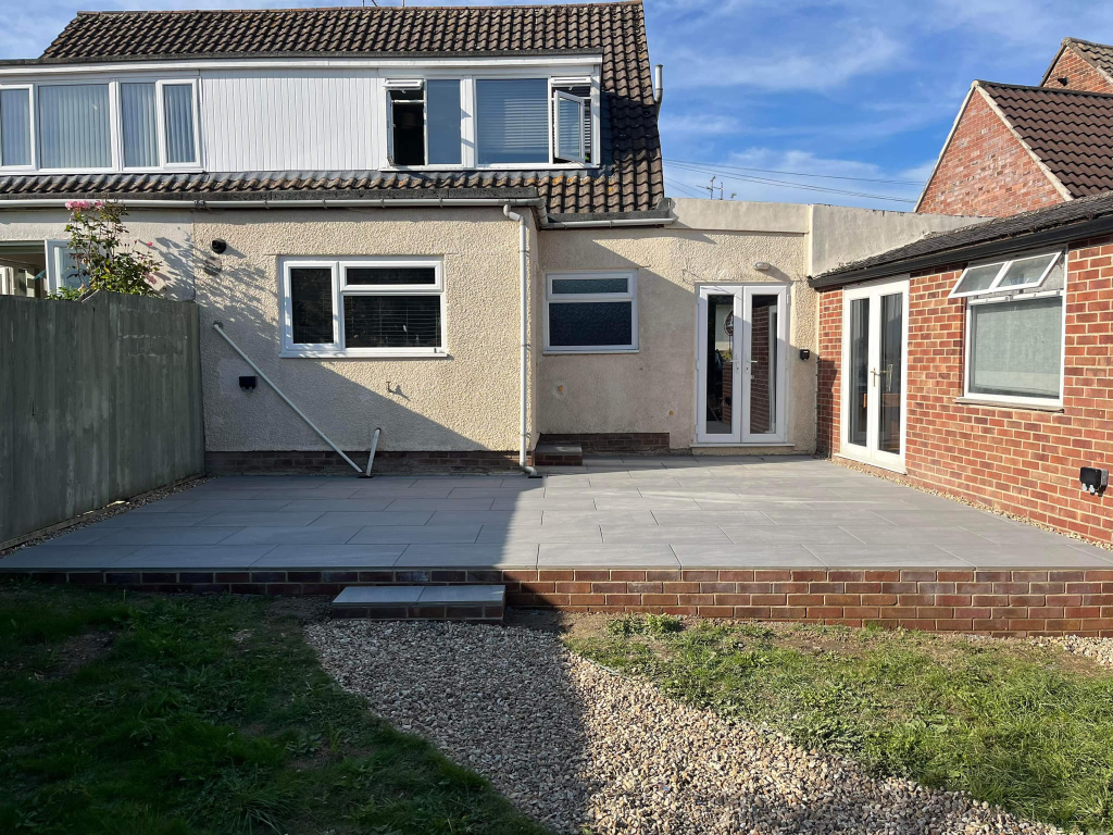 Porcelain Patio with Retaining Wall & Step photo 1