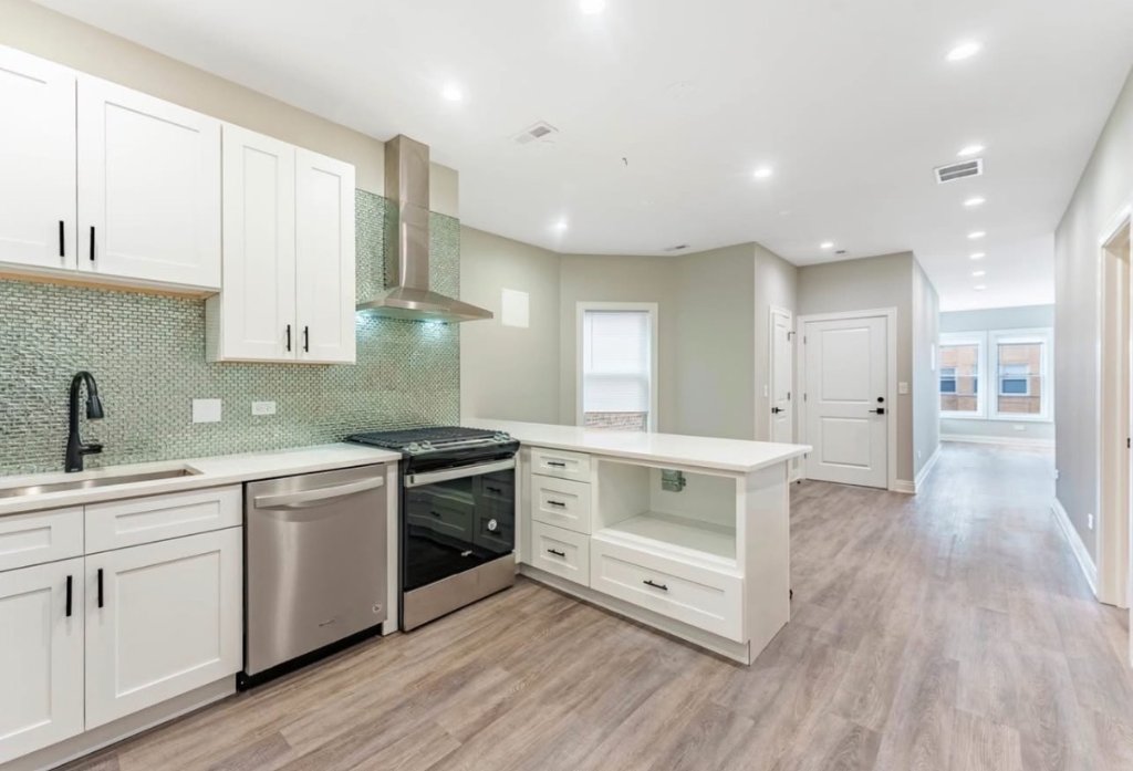 Modern White Kitchen with Herringbone Backsplash