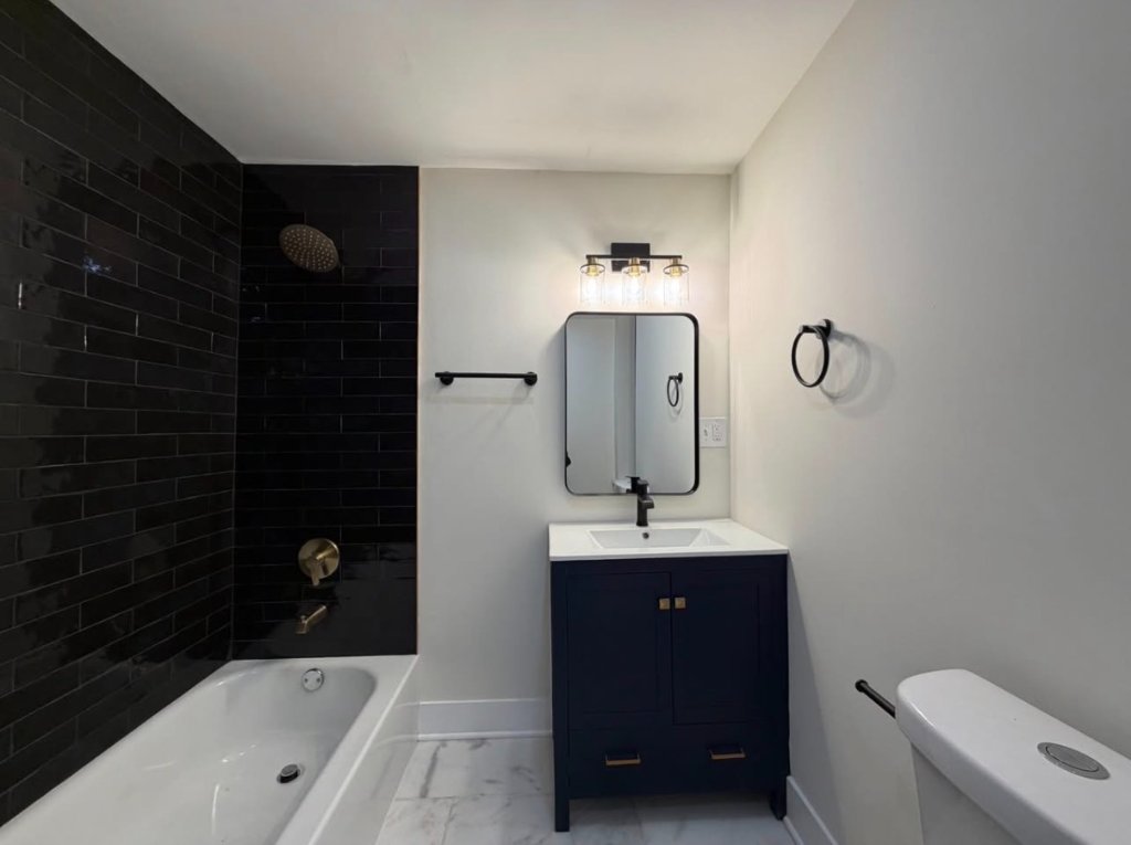 Black Subway Tile & Navy Vanity Bathroom