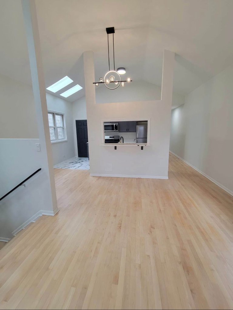 Light Wood Plank Flooring with Modern Kitchen