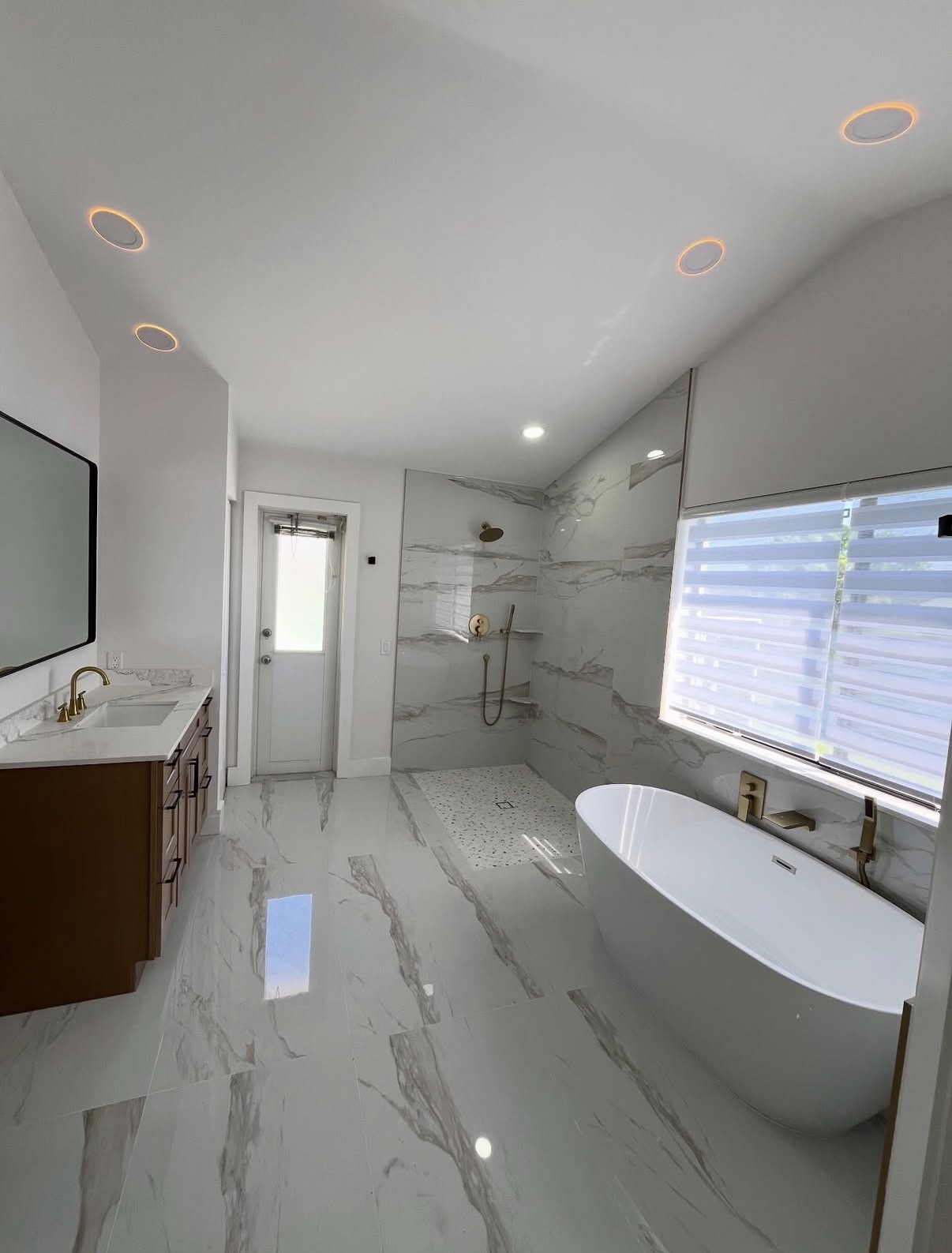 Finished bathroom remodel in Hinsdale, IL — vanity, walk-in shower, and freestanding soaking tub