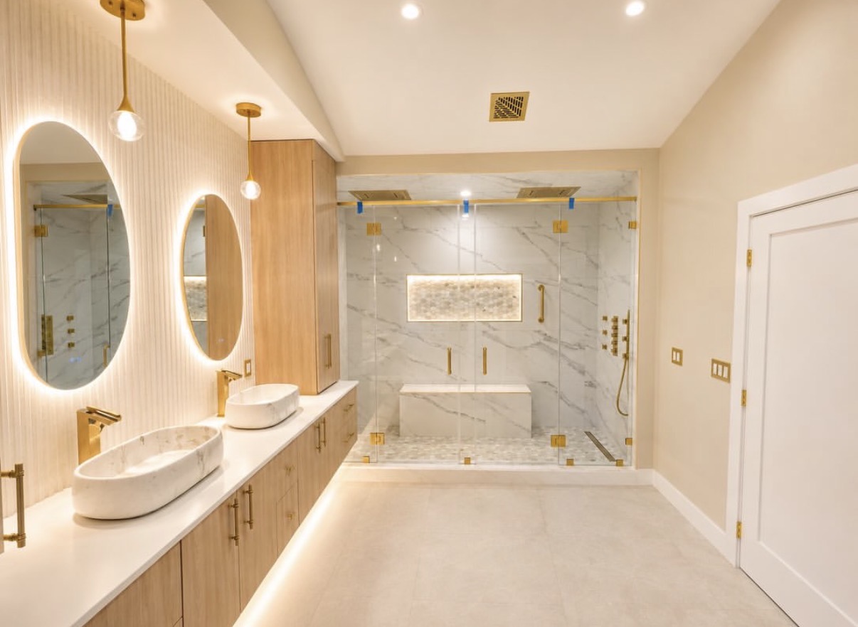 Luxury spa bathroom remodel in Burr Ridge, IL with frameless glass shower, freestanding jetted tub, and floating double vanity