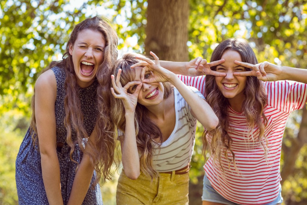 Friends laughing together outdoors