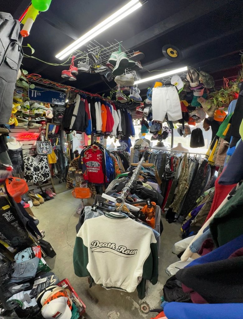 Inside Sold Out Society thrift shop downtown LA packed vintage streetwear racks hats jackets sneakers