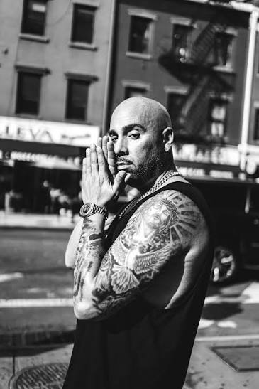JoJo Pellegrino on a Staten Island street, hands pressed together