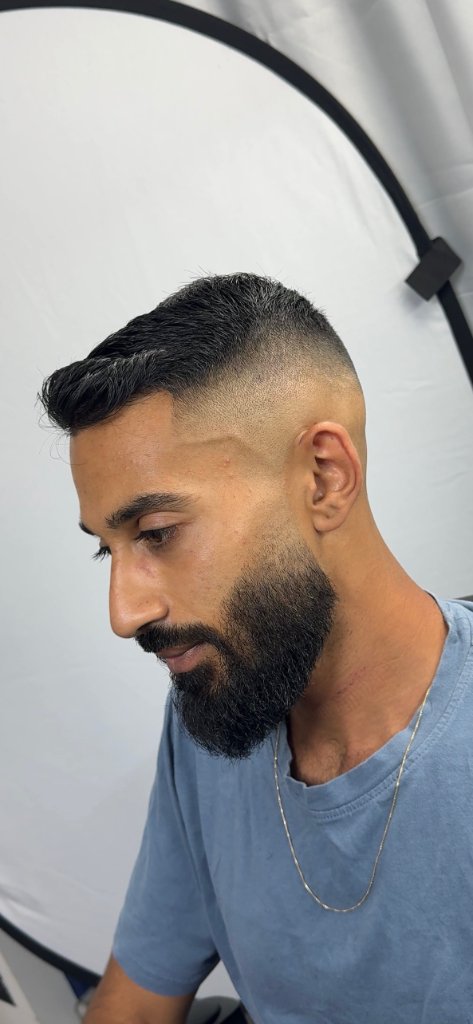 Mid fade with full beard