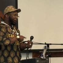 M.J. Evans — Speaking Presentation (Microphone)