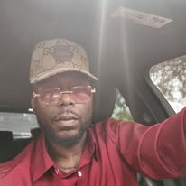 M.J. Evans — On the Go (Red Shirt)