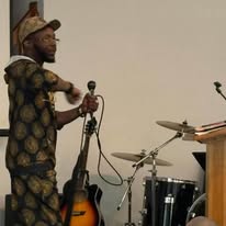 M.J. Evans — Speaking Engagement (Microphone)