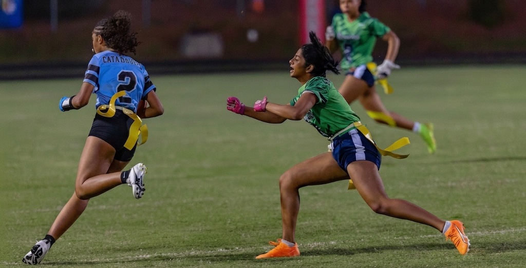 In pursuit — reaching for the flag in an intense night game